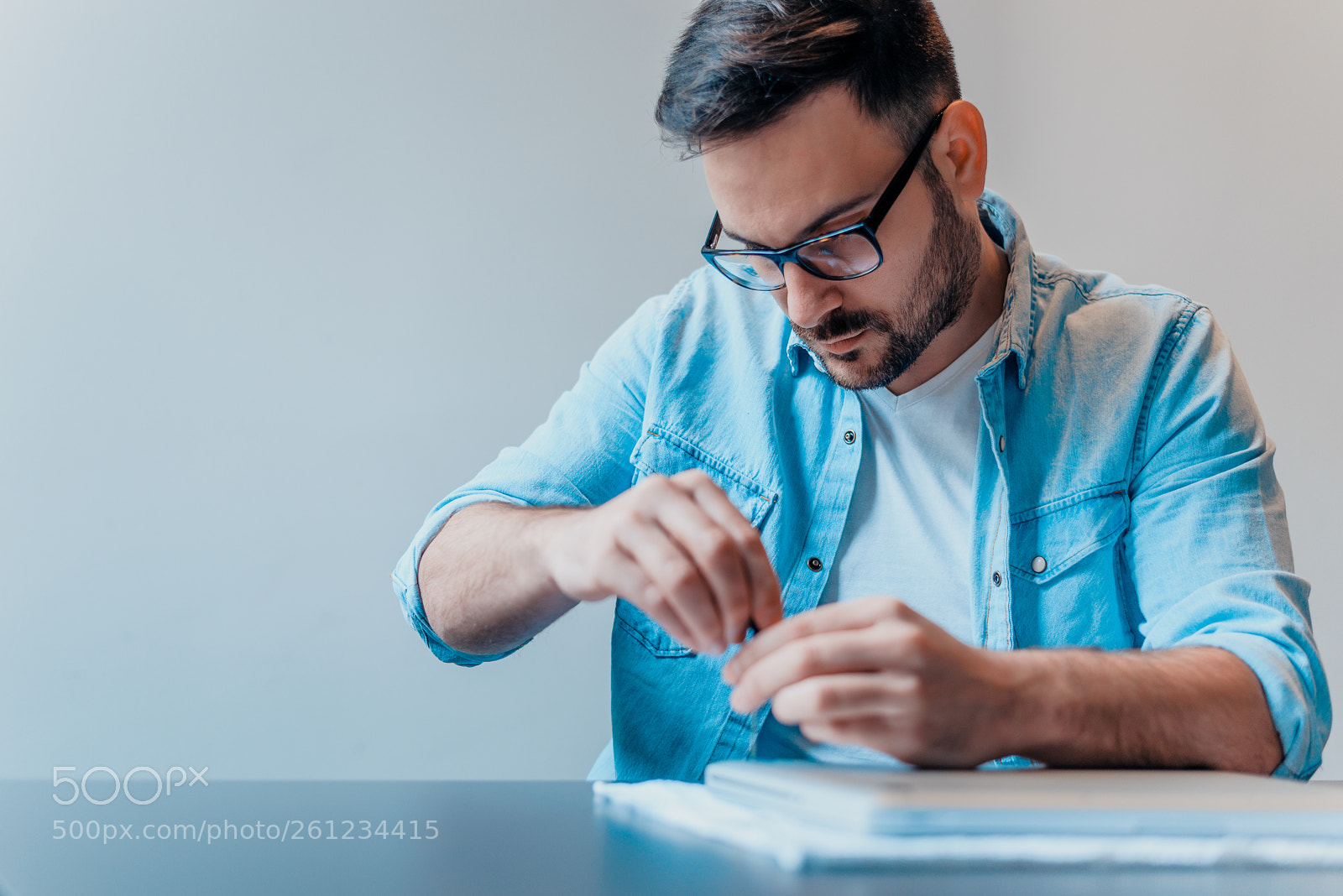 Nikon D610 sample photo. Young bearded repairman repairing photography
