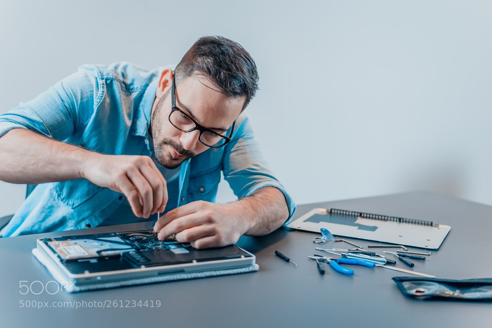 Nikon D610 sample photo. Handsome computer technician dismantling photography
