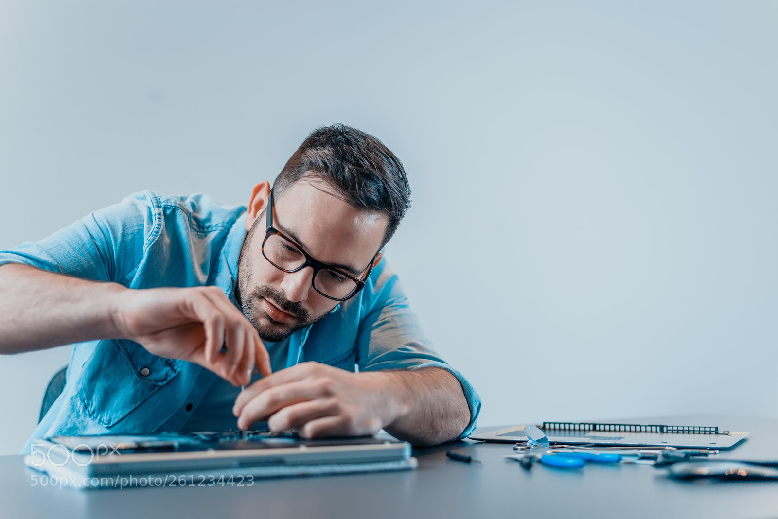 Nikon D610 sample photo. Focused computer engineer repairing photography
