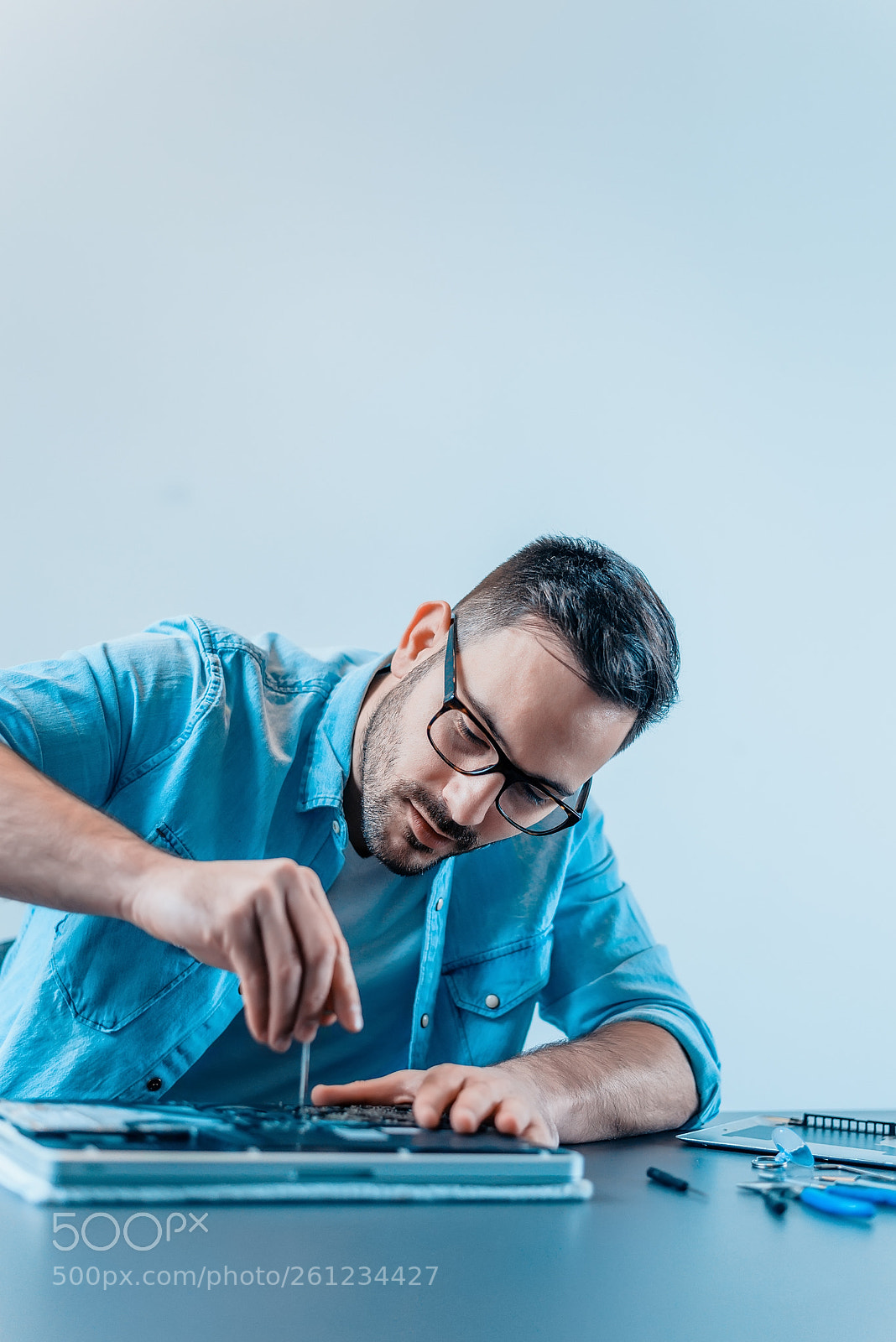 Nikon D610 sample photo. Young man repairing laptop photography