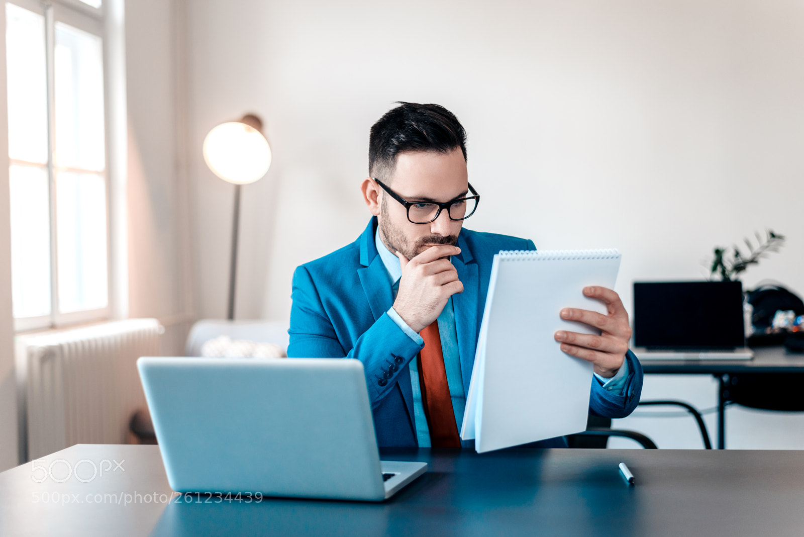 Nikon D610 sample photo. Concentrated young businessman reading photography