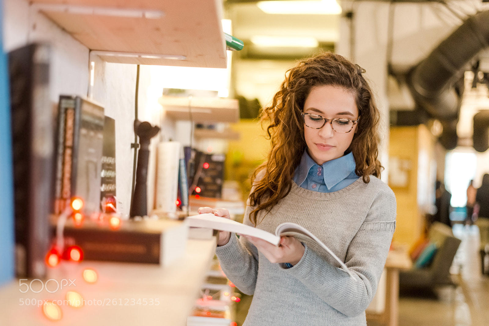 Nikon D610 sample photo. Woman holding and reading photography