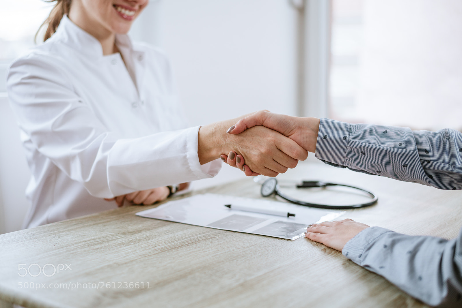 Nikon D610 sample photo. Handshake between doctor and photography