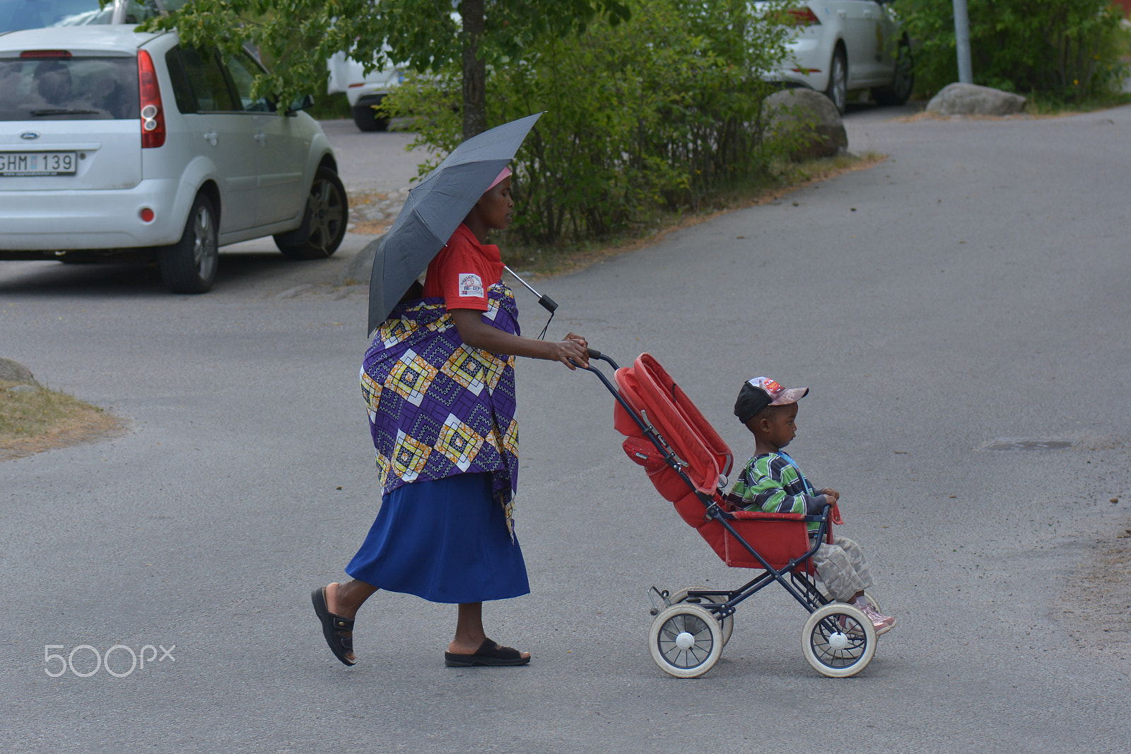 Nikon AF-S Micro-Nikkor 105mm F2.8G IF-ED VR sample photo. A lady with a pram. photography