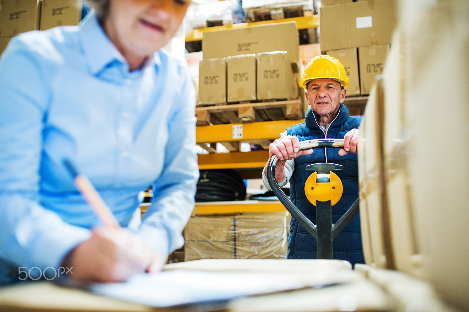 Nikon D4S sample photo. Senior woman manager and man worker working in a warehouse. photography