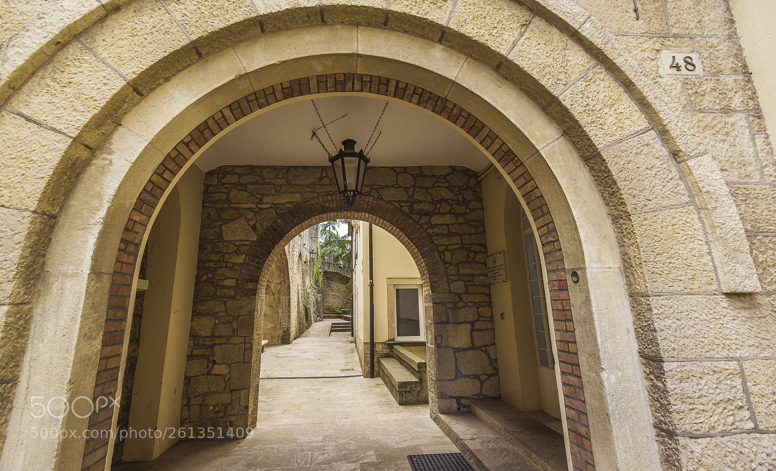 Nikon D700 sample photo. Under an arcade in photography