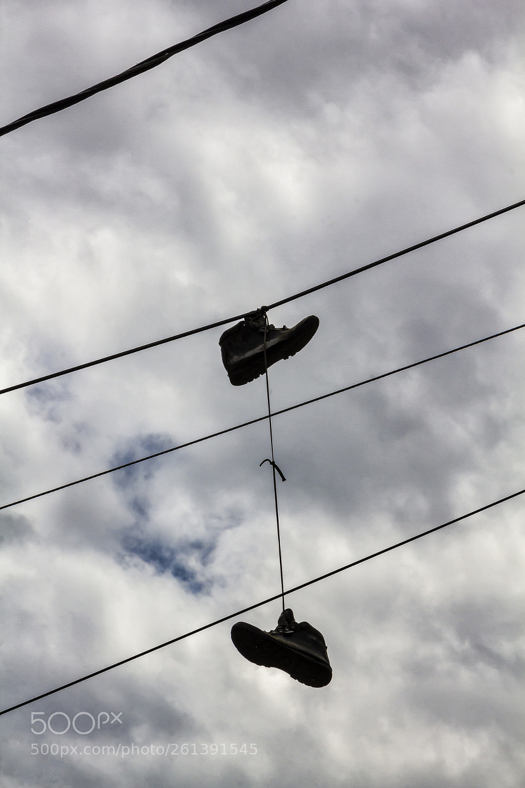 Canon EOS 60D sample photo. Sneaker on phone lines photography
