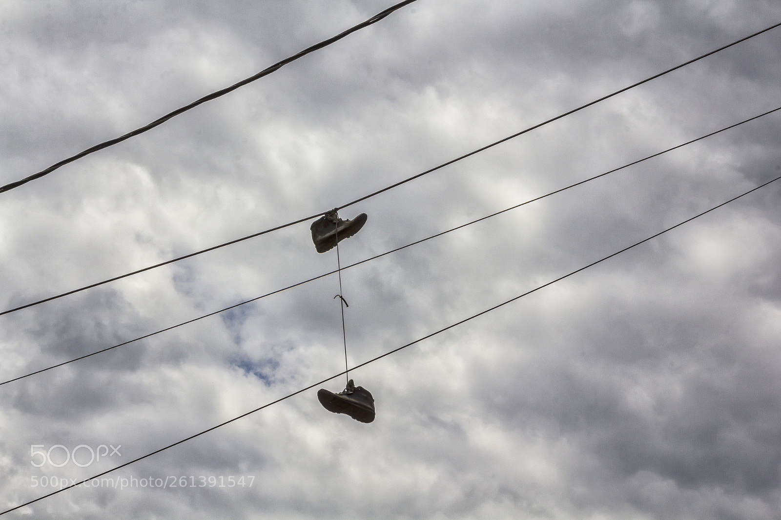 Canon EOS 60D sample photo. Sneakers on phone lines photography