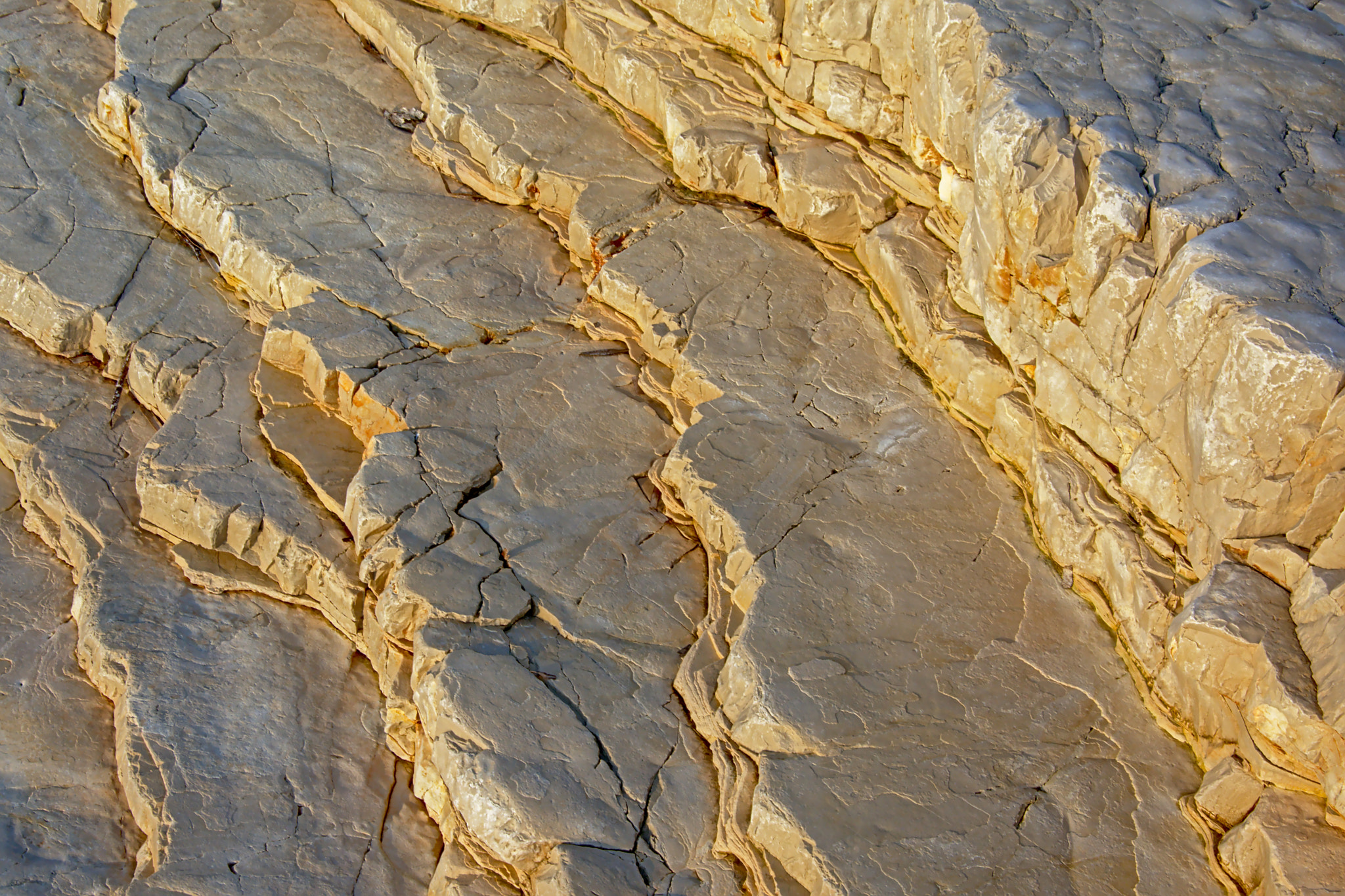 Nikon D5200 sample photo. Cracked limestone rock with sun and shadow pattern photography