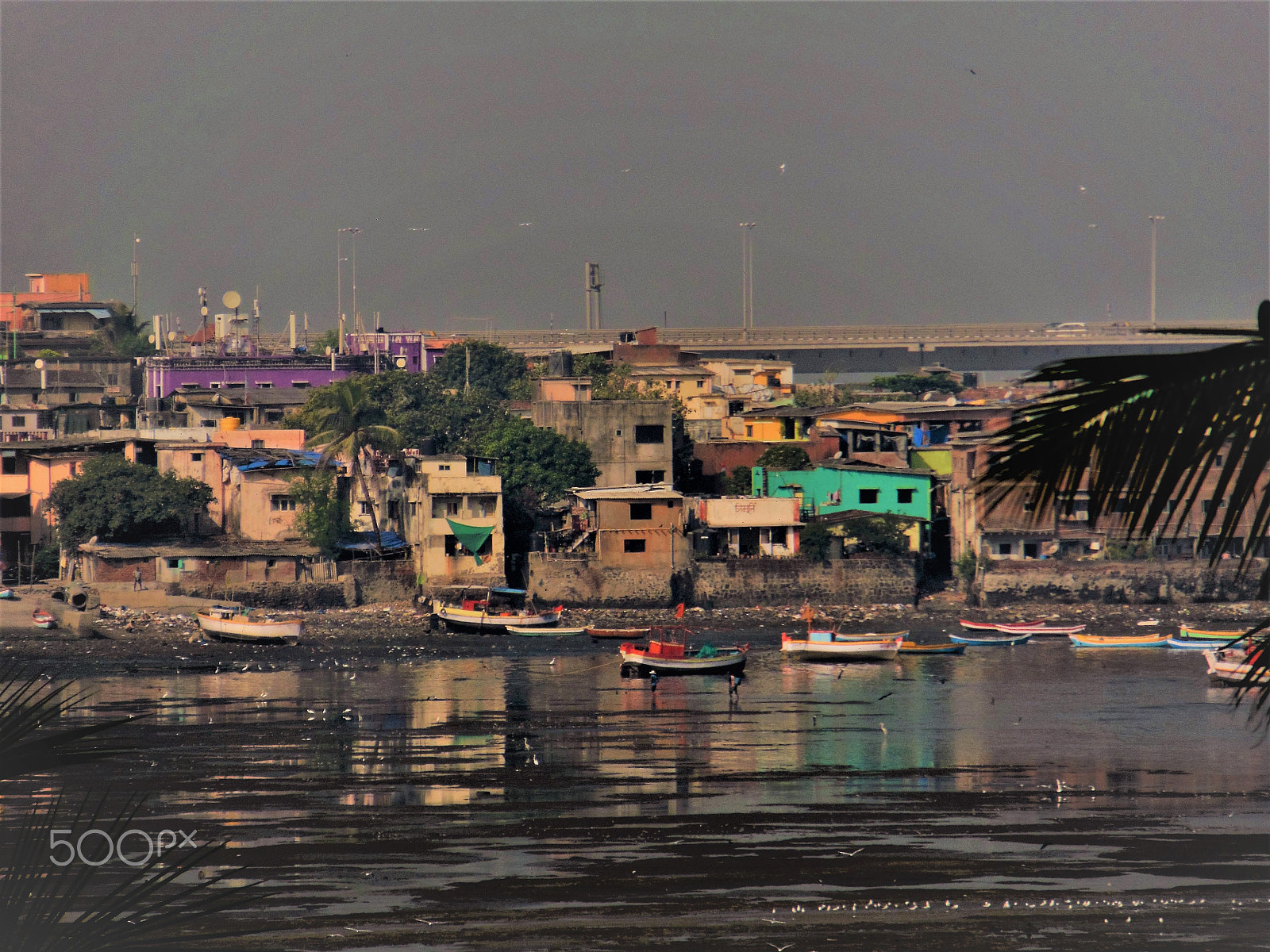 Nikon COOLPIX S9200 sample photo. Dark skies over a mumbai fishing village photography