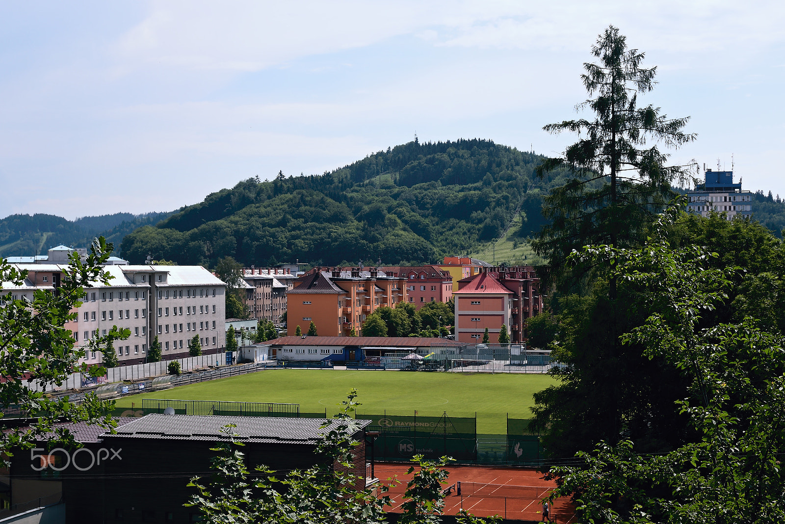 Nikon D5300 sample photo. Vsetin, czech republic - june 02, 2018: football field between old houses  in sunny day photography