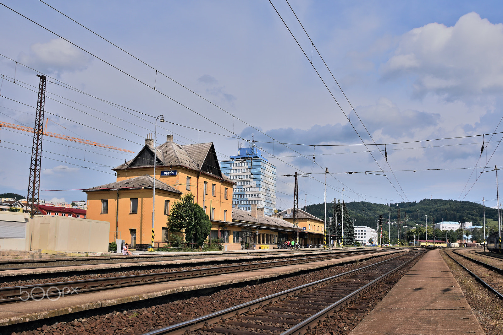 Nikon AF-S DX Nikkor 18-140mm F3.5-5.6G ED VR sample photo. Vsetin, czech republic - june 02, 2018: peron, tracks and buildings of main train station of... photography