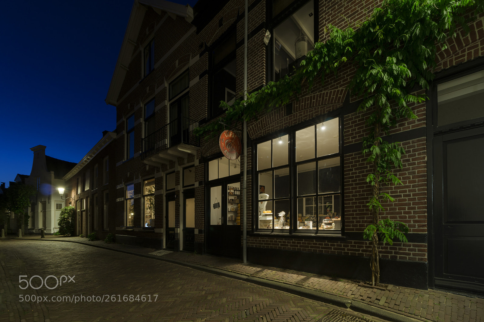 Sony a6000 sample photo. Cheese shop blue hour photography