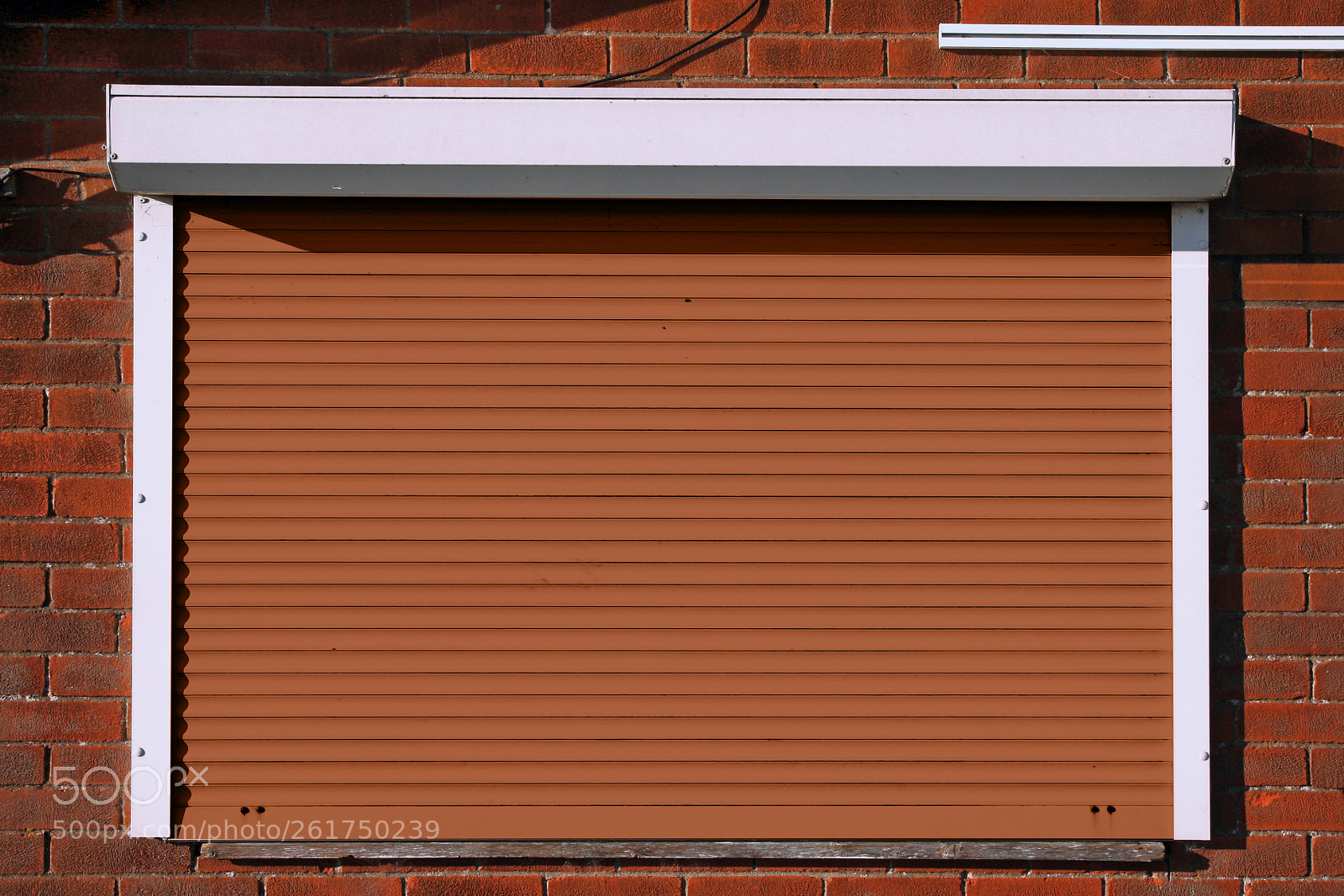 Canon EOS 40D sample photo. Closed orange security shutters photography