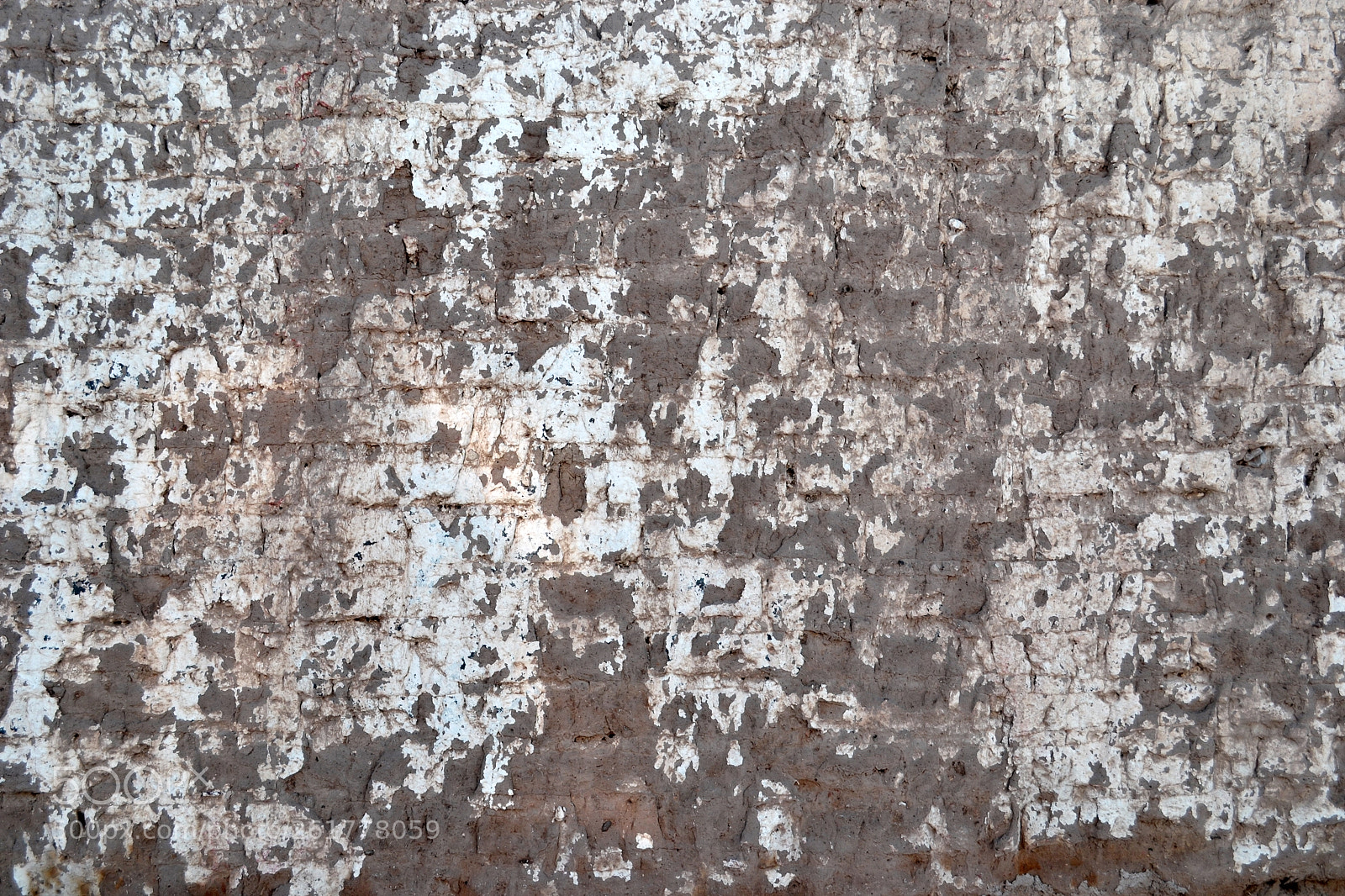 Nikon D3100 sample photo. Adobe clay town wall photography