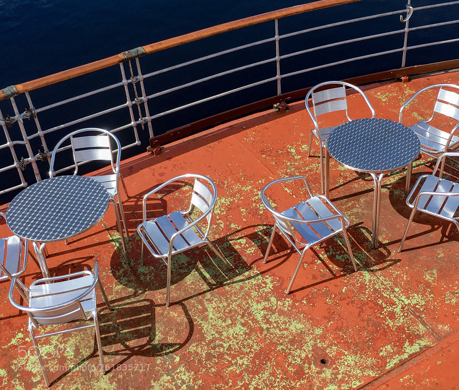 Apple iPhone SE sample photo. Chairs and deck, maid photography