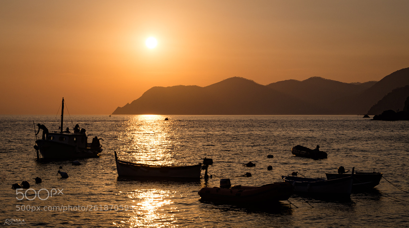 Nikon D5200 sample photo. Sunset behind boats photography