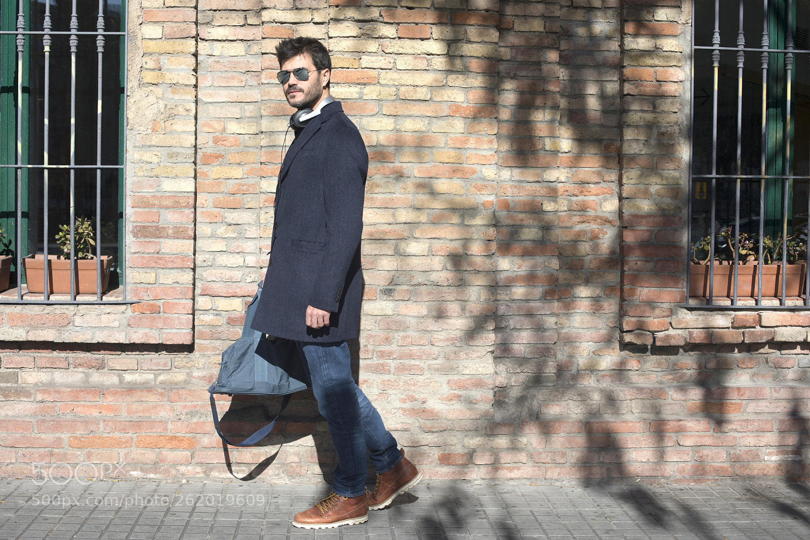 Canon EOS 5D Mark IV sample photo. Man standing and carrying photography