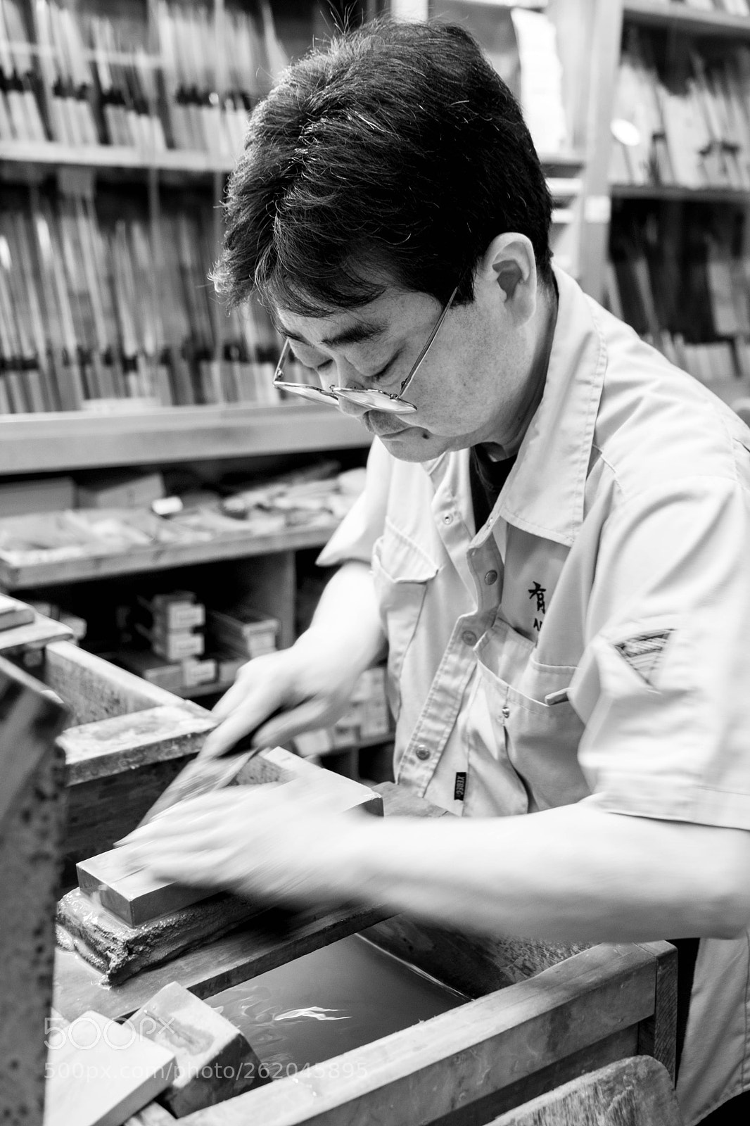 Fujifilm X-T20 sample photo. Knife sharpener at work photography