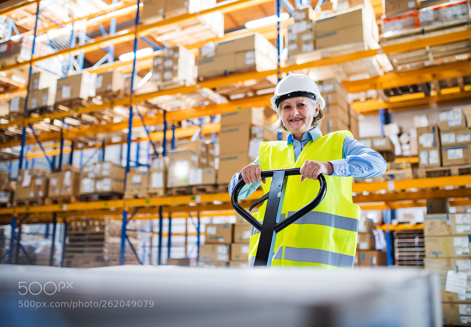 Nikon D5 sample photo. A senior woman warehouse photography