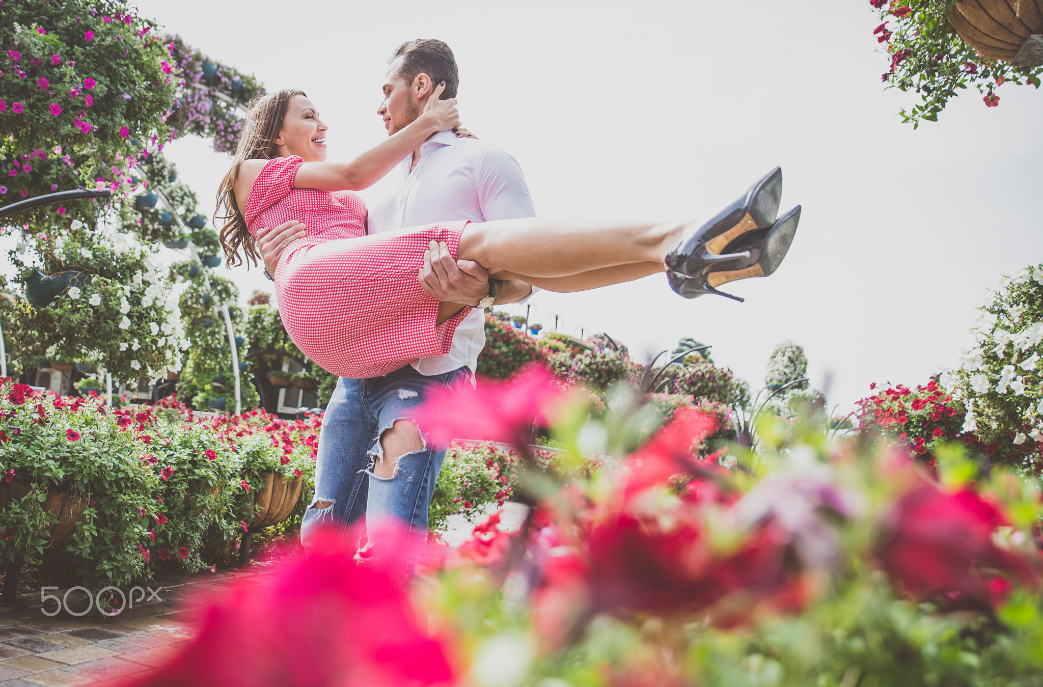 Happy couple spending time in a flower park