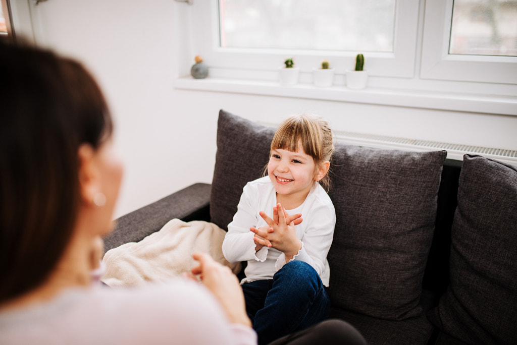 Adorable blonde little girl having fun at home. Family time. by Branislav Nenin on 500px.com