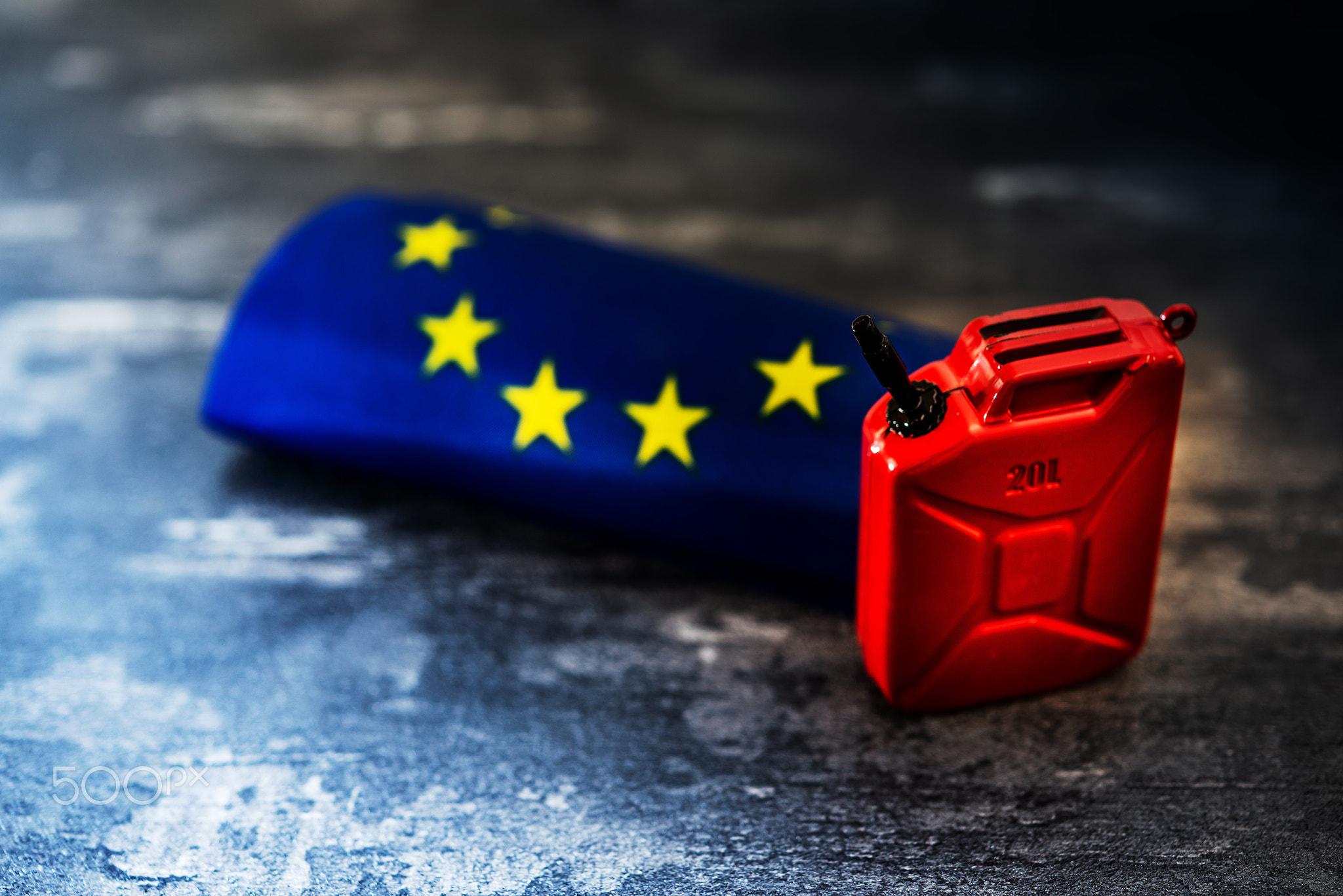 Europe flag and oil Barrel on black field
