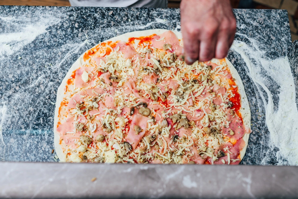 Delicious pizza preparation. Top view. by Branislav Nenin on 500px.com