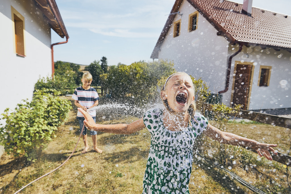 Children having fun with splashing water by Jaromír Chalabala on 500px.com