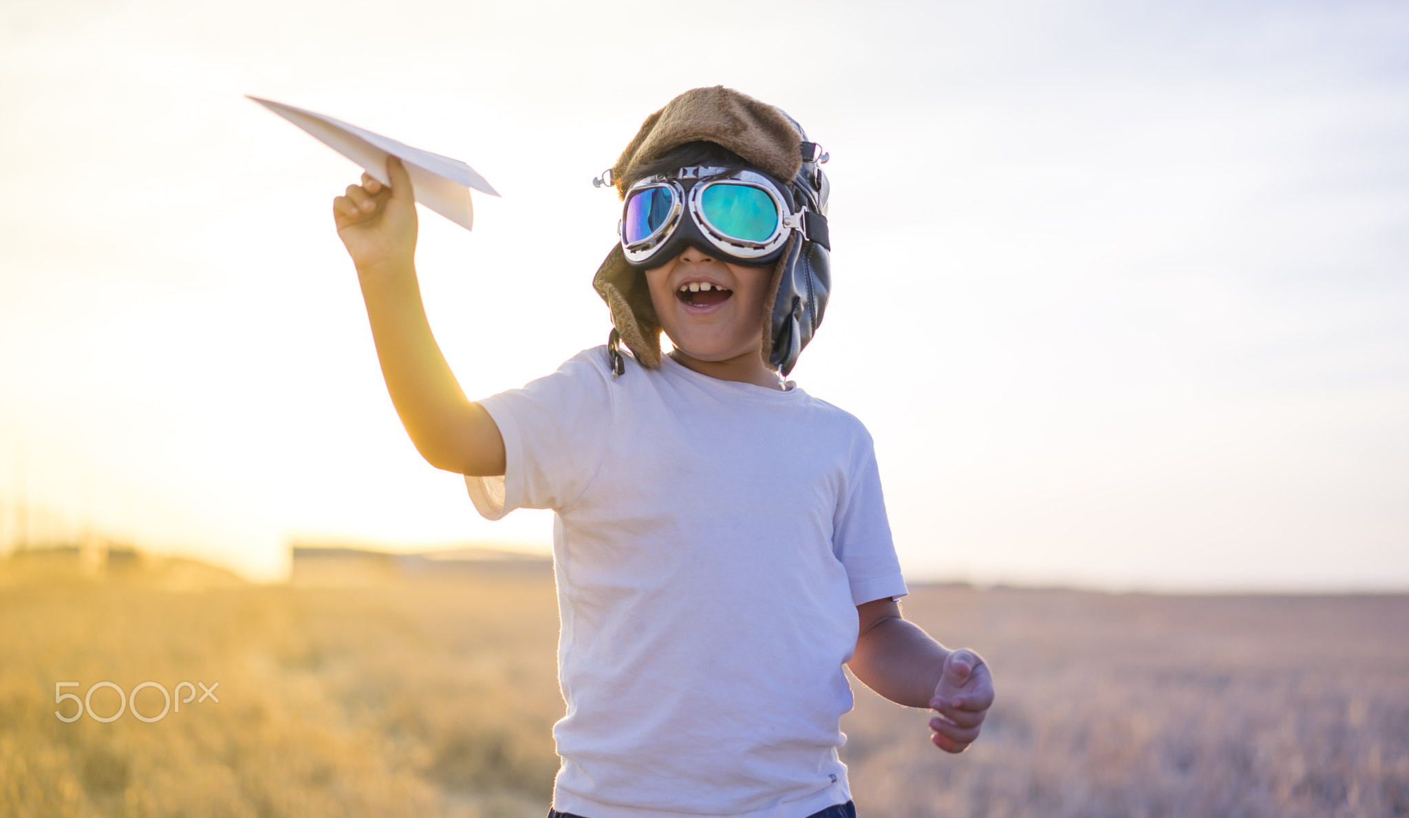 Kid, Little boy wearing helmet and dreams of becoming an aviator