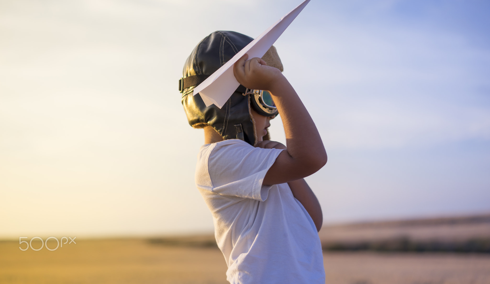 Imagination, Little boy wearing helmet and dreams of becoming an