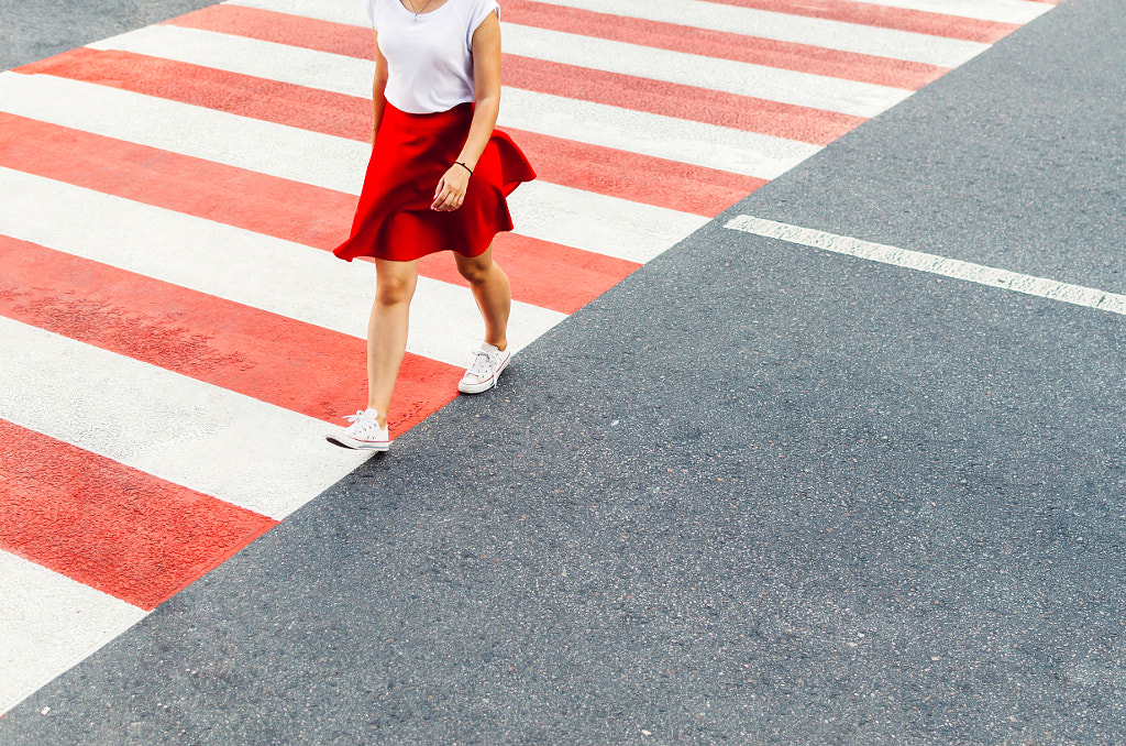 Red white pedestrian crossing with women in red by Bohdan Melnyk on 500px.com
