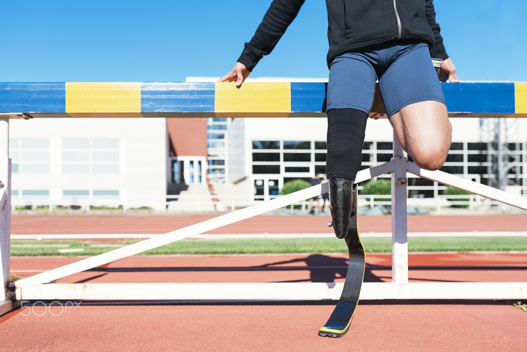 Disabled  athlete stretching with leg prosthesis