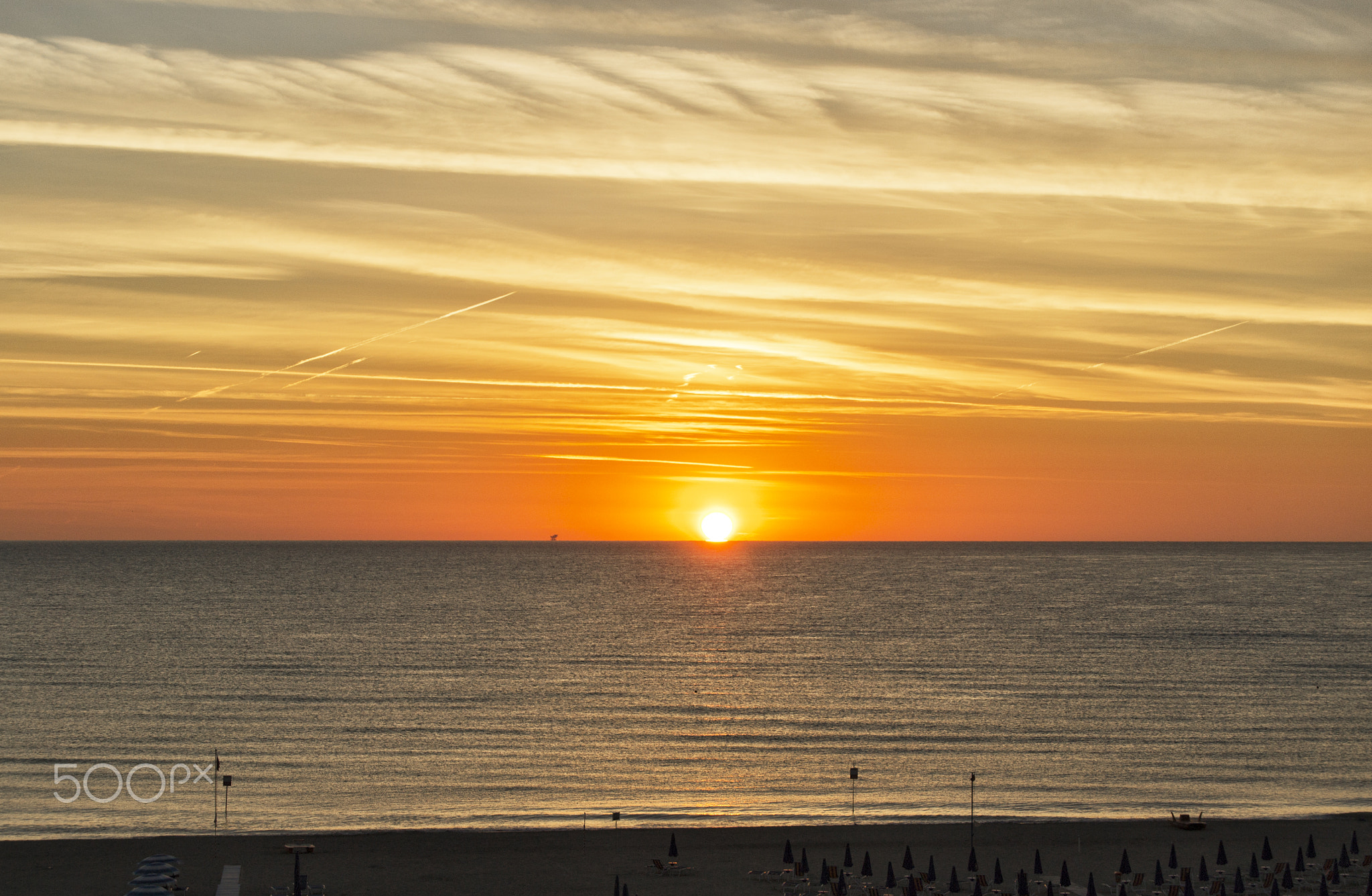 orange dawn over mediterranean sea in summer. for travel and naturalistic concept.