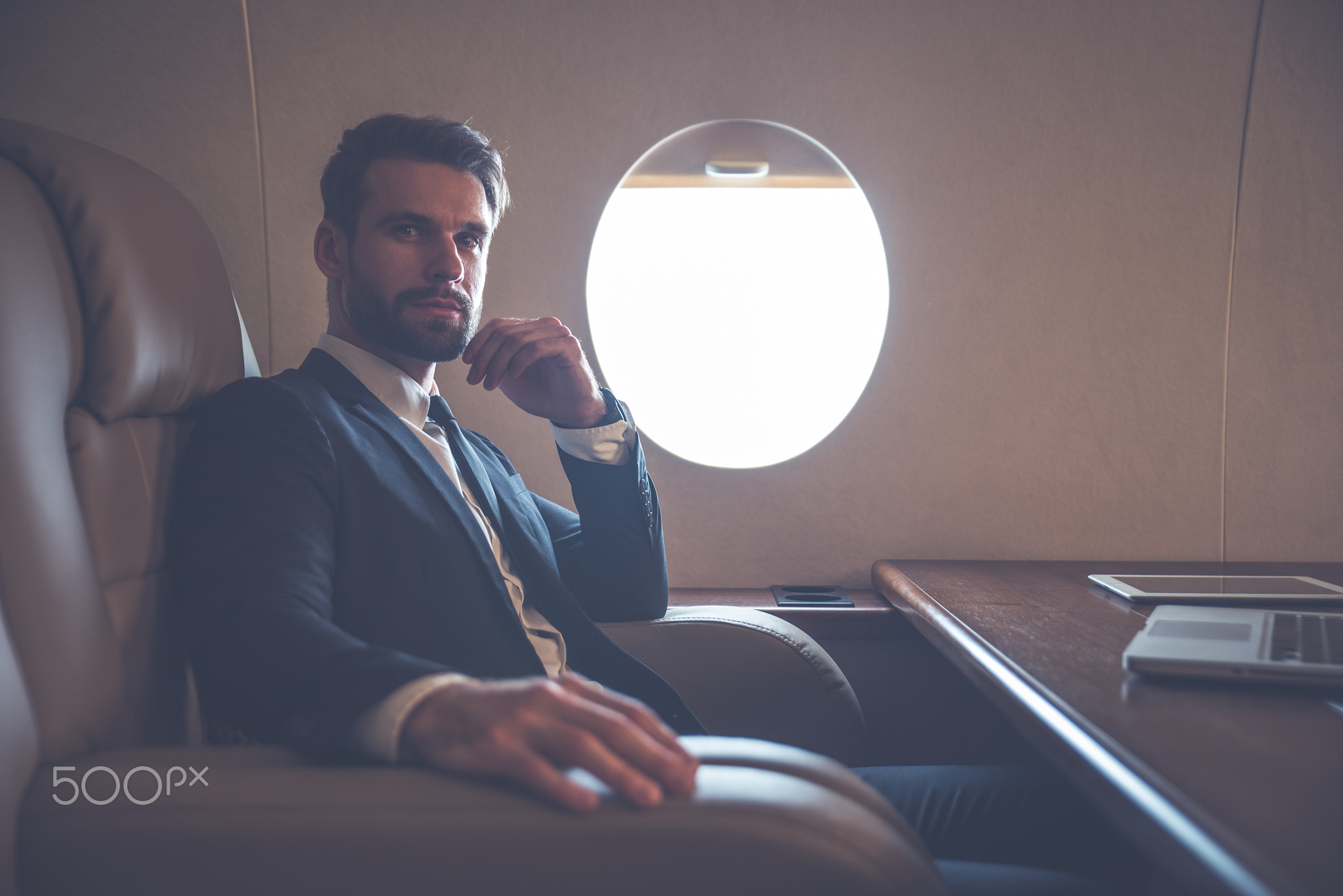 Businessman flying on his private jet