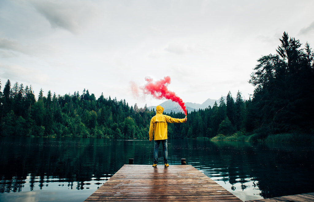 Man standing on the lake walkway by Cristian Negroni on 500px.com