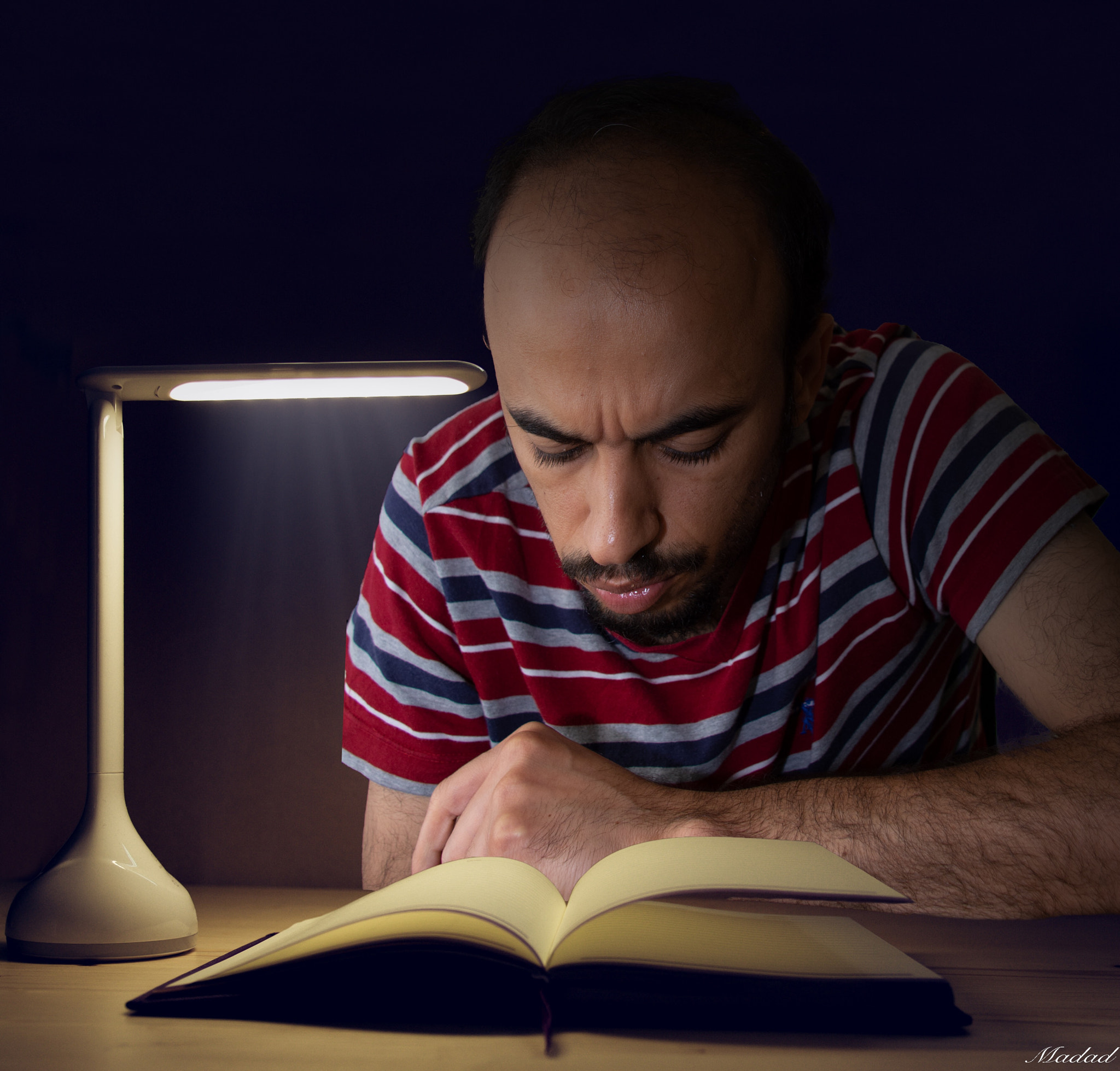 Office desk with Led lamp and paperwork stack