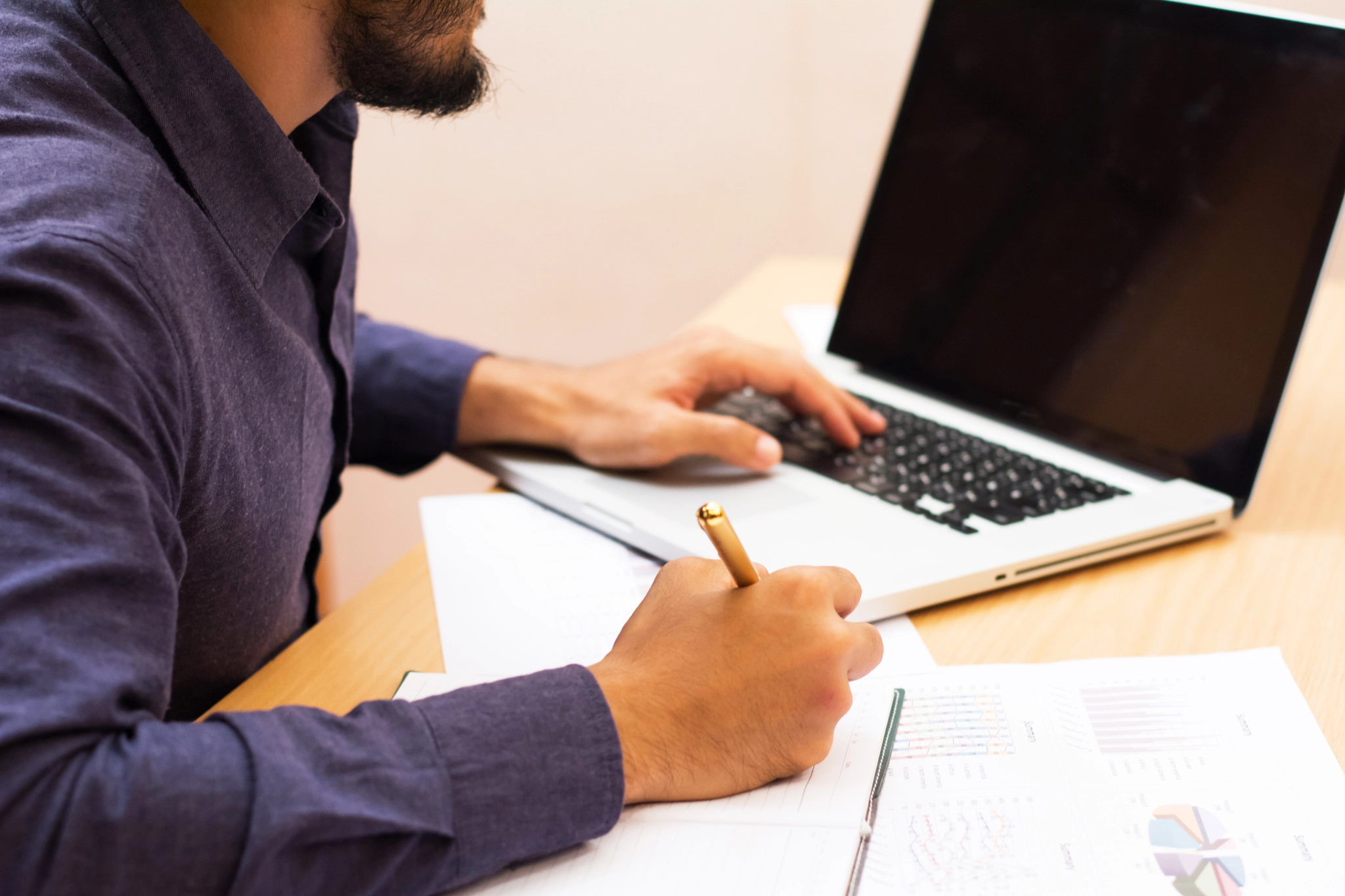 Business man working at office with phone.tablet and graph data