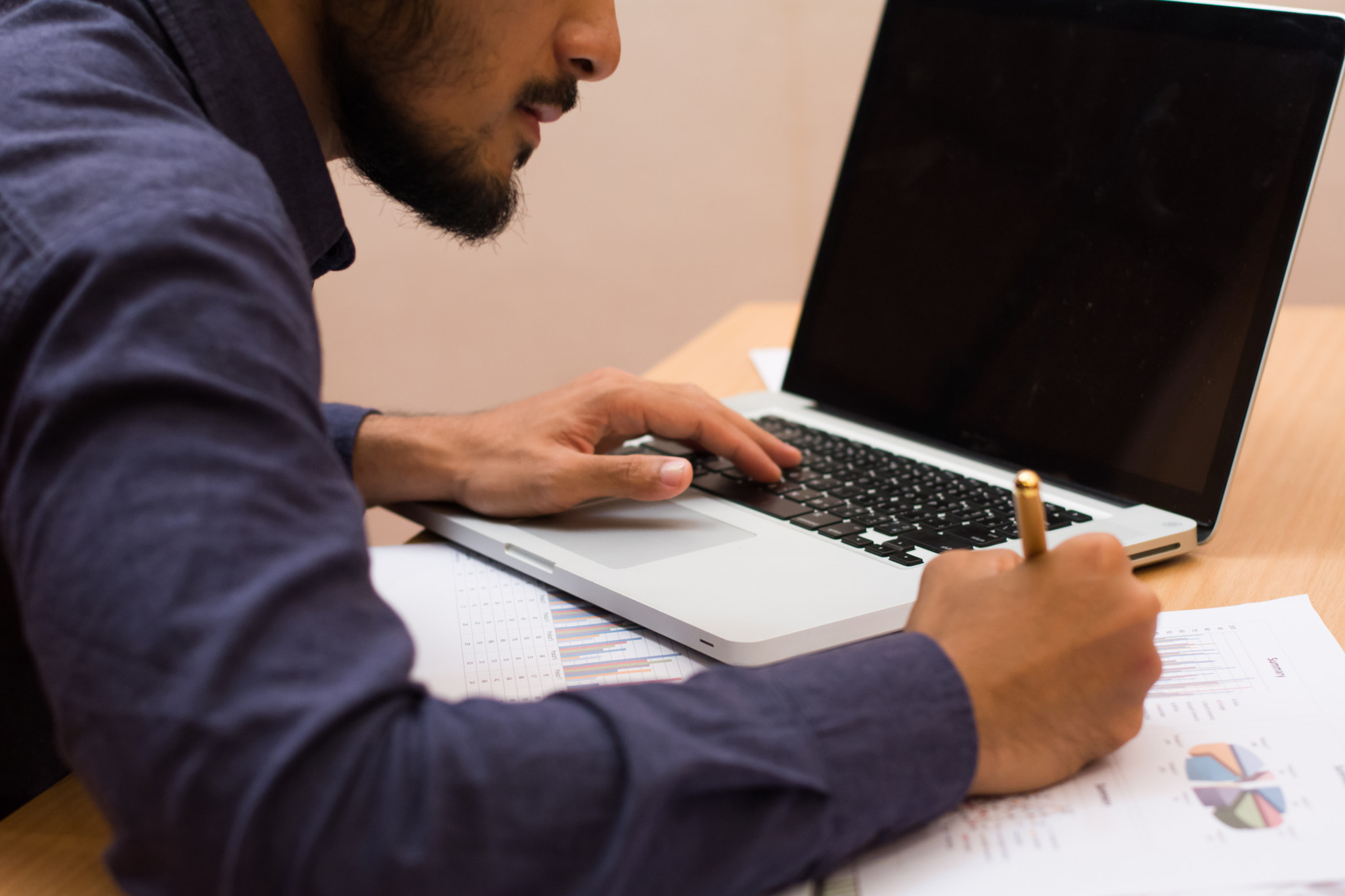 Business man working at office with phone.tablet and graph data