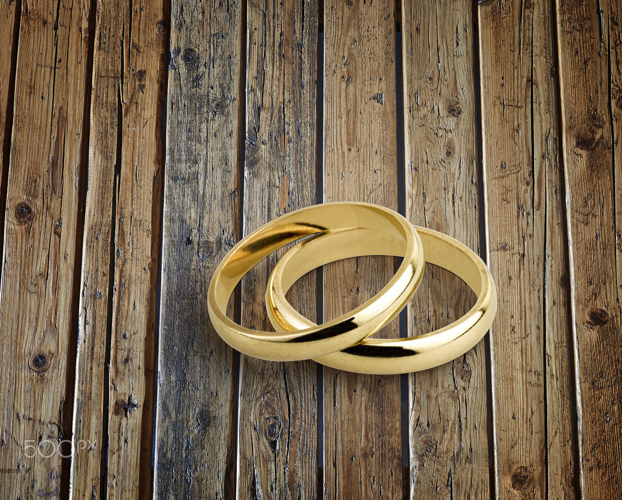 old wedding rings on rustic wooden table board
