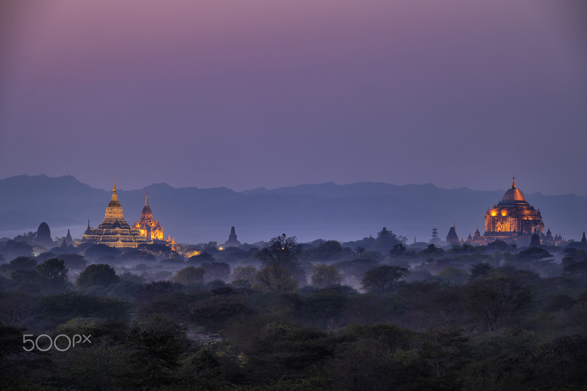 Pagoda landscape under a warm sunset in the plain of Bagan, Myanmar (Burma)