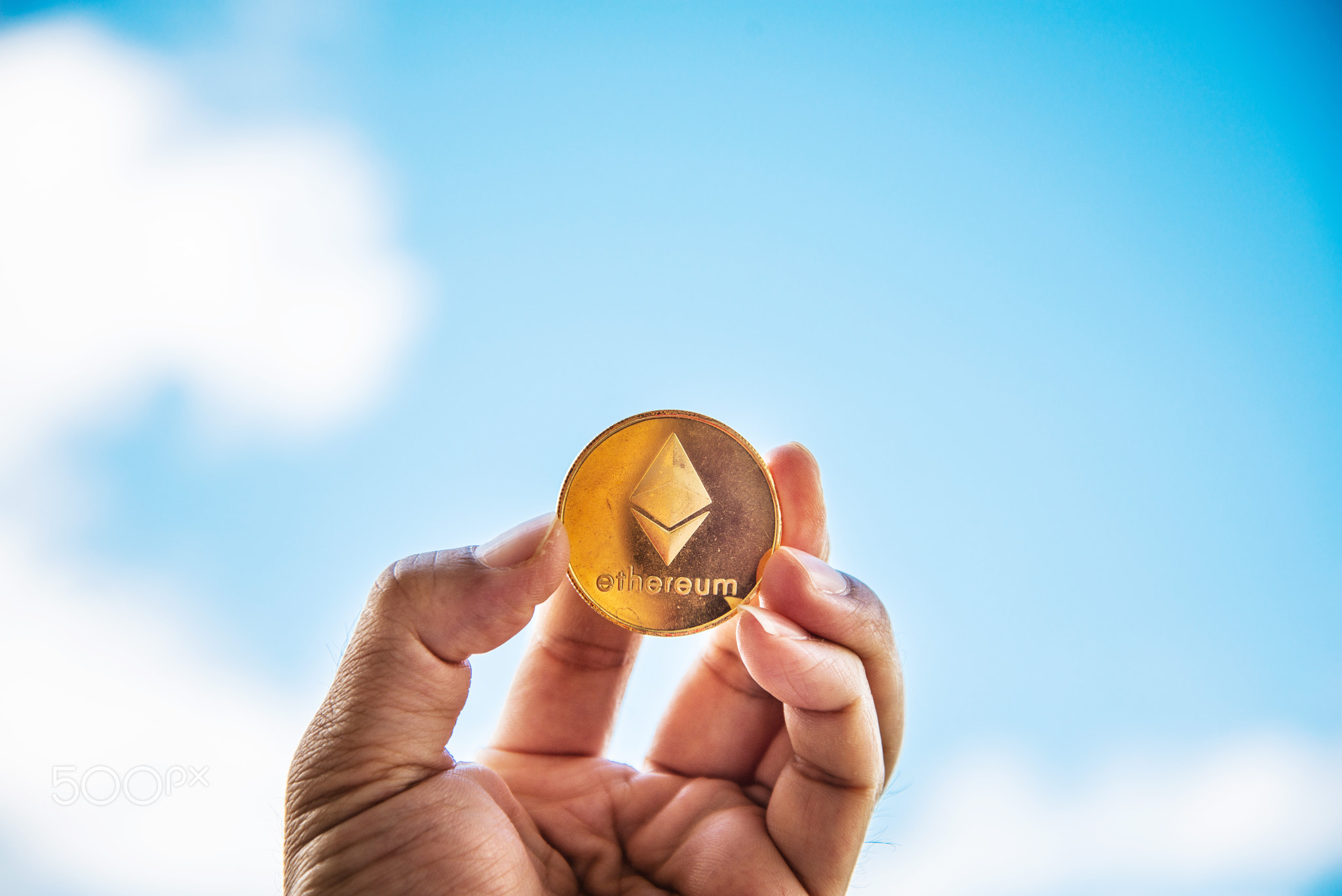 Crypto Ethereum currency Bitcoin Sky background concept