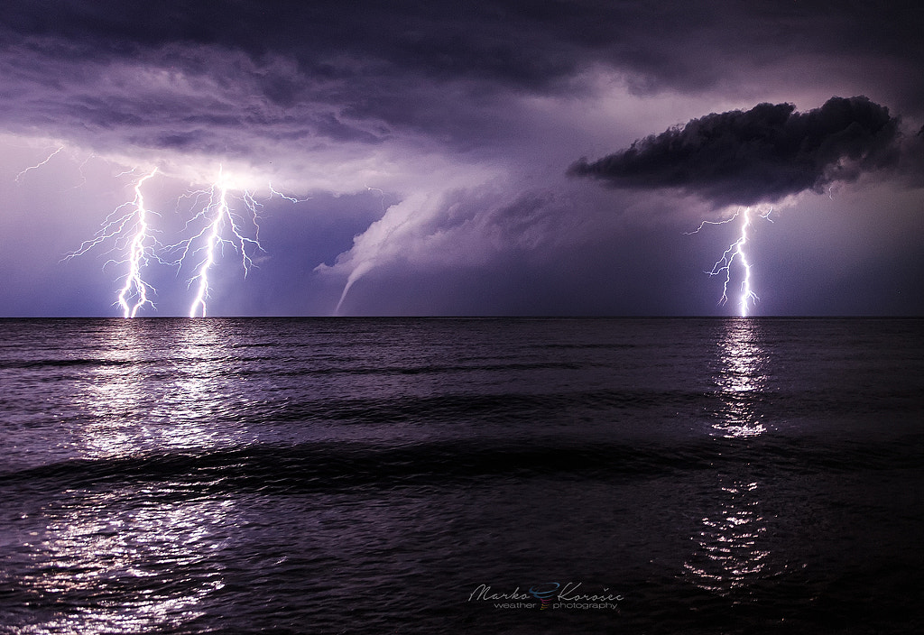 Lifetime shot of lightning and waterspout by Marko Korošec on 500px.com