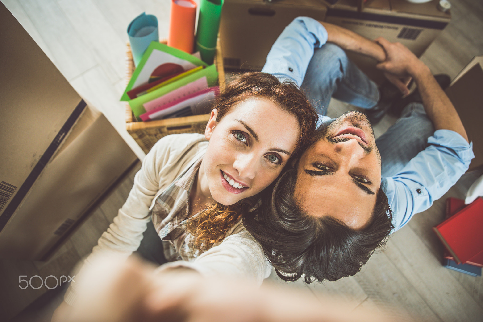 Young couple moving in into new apartment
