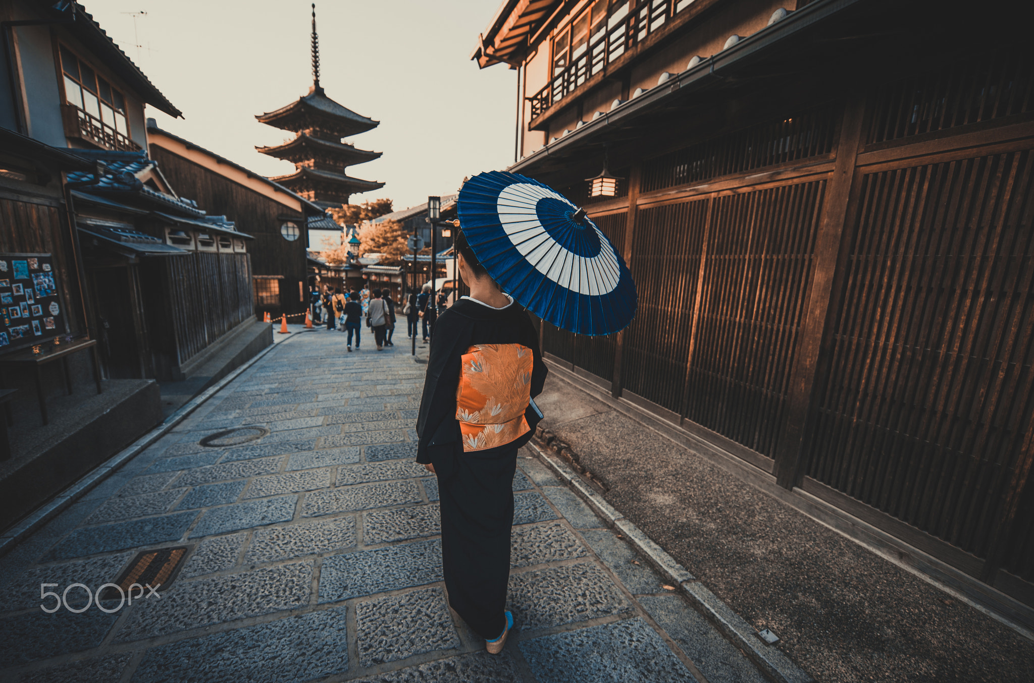 Beautiful japanese senior woman walking in the village. Typical