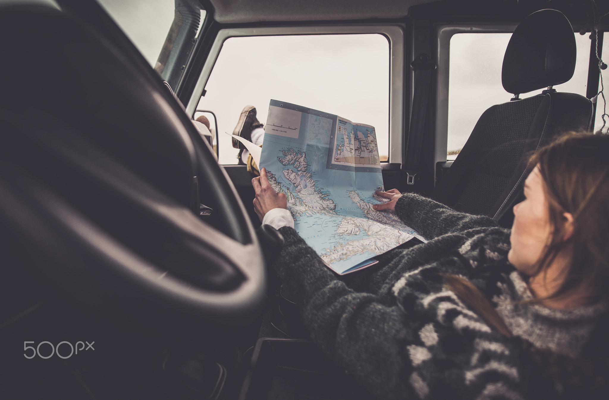 Woman looking at the map during the journey