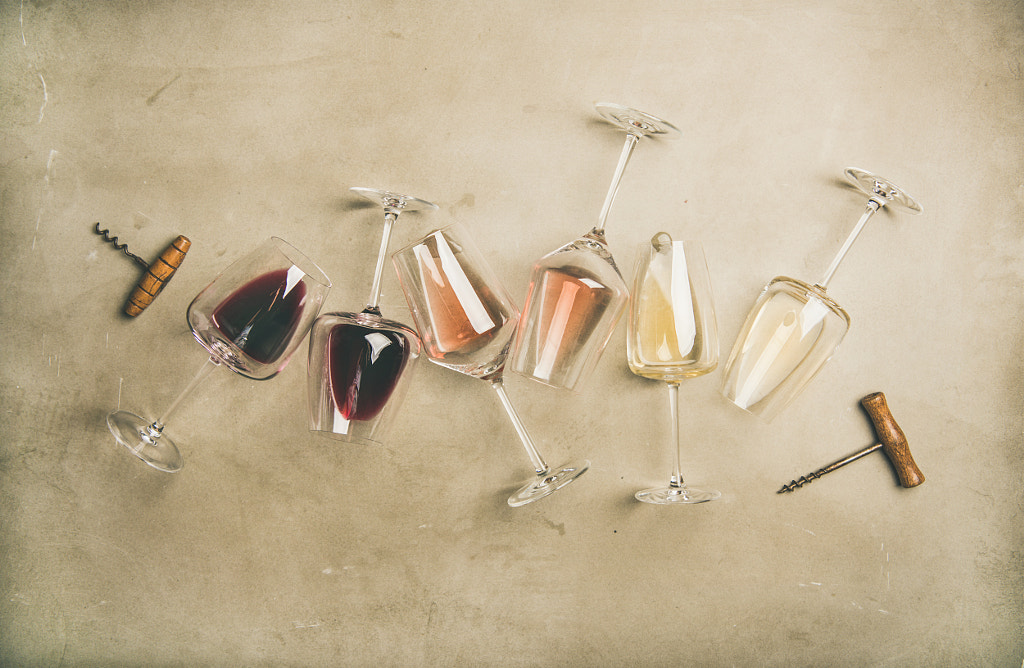 Red, rose and white wine in glasses and corkscrews by Anna Ivanova on 500px.com