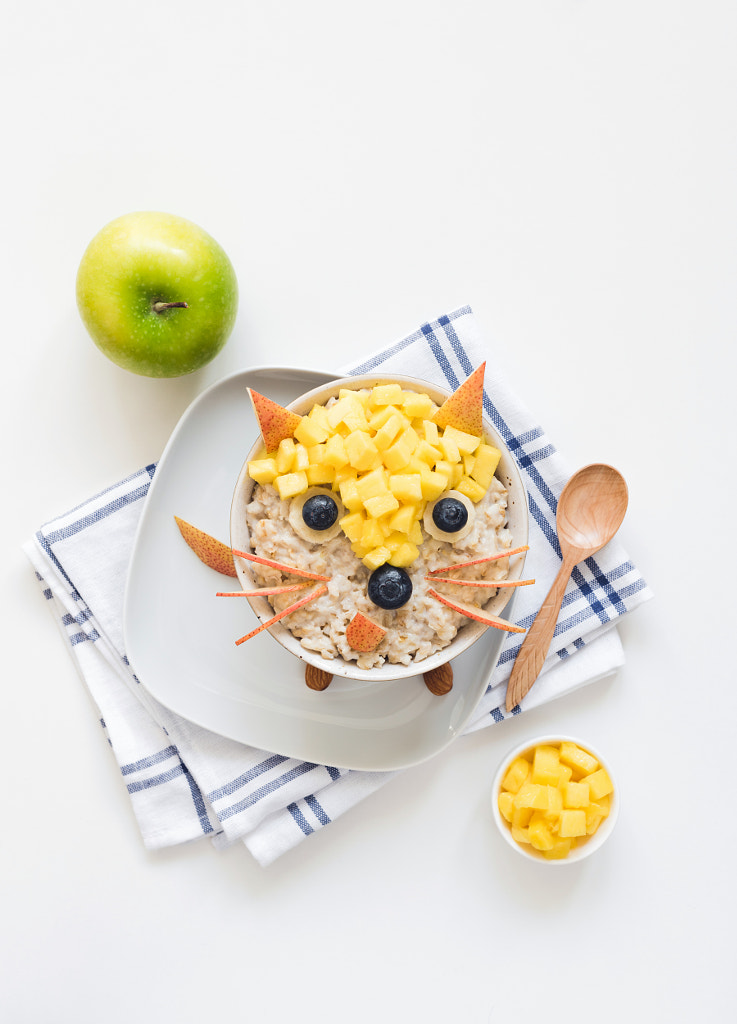 Oatmeal porridge with cute funny face, kids breakfast by Vladislav Nosick on 500px.com