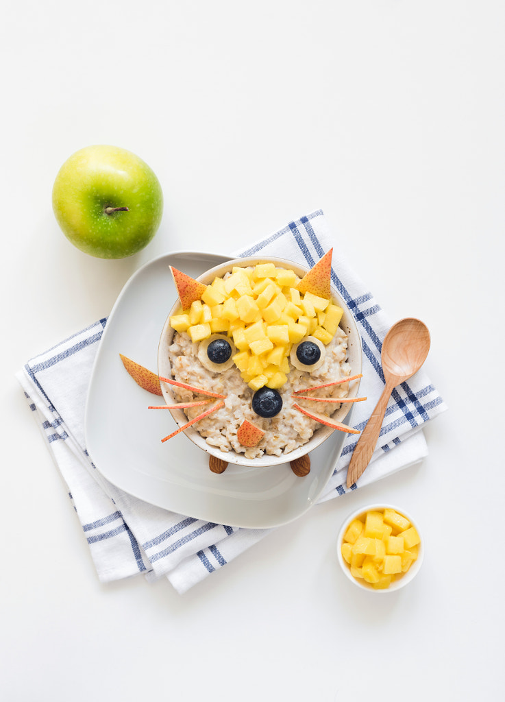 Oatmeal porridge with cute funny face, kids breakfast by Vladislav Nosick on 500px.com