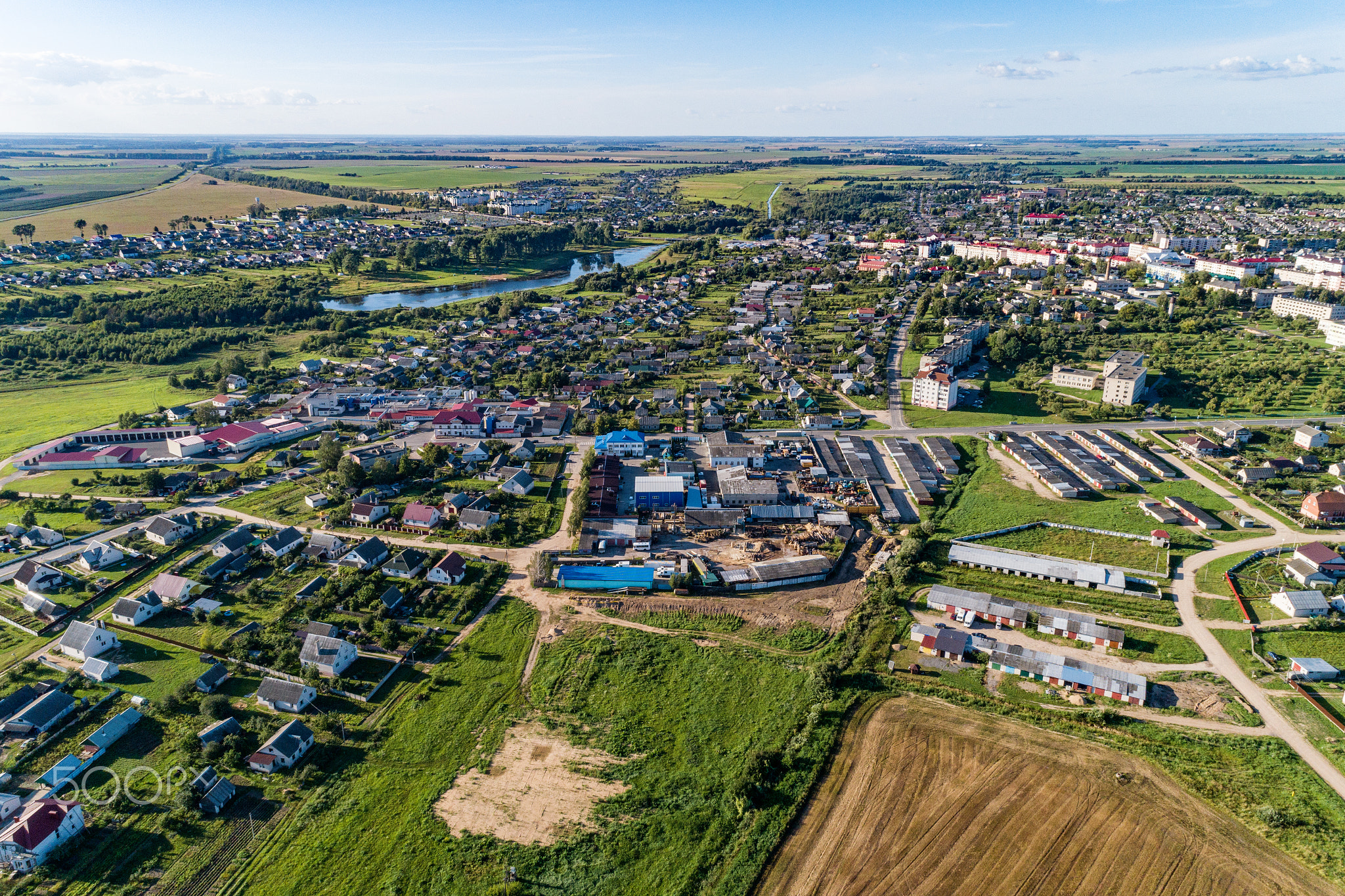 A small European city, summer evening. A bird's-eye view